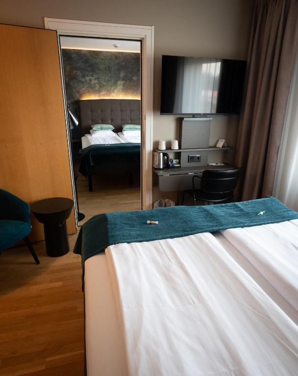 Postel nebo postele na pokoji v ubytování Best Western Hotel Vidöstern