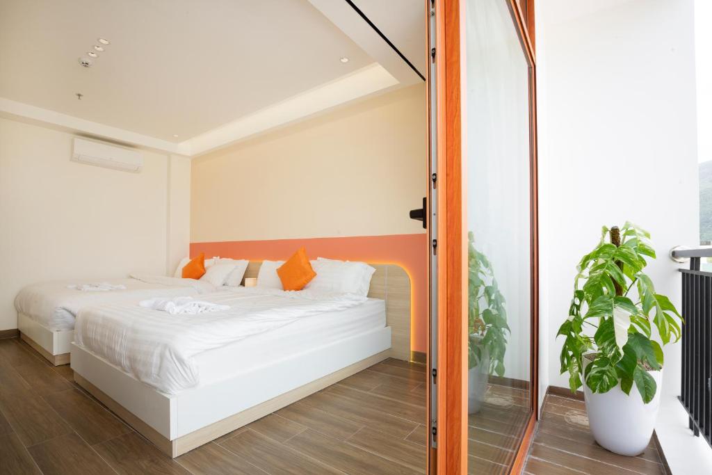 Postel nebo postele na pokoji v ubytování Sonder Homestay Quy Nhon