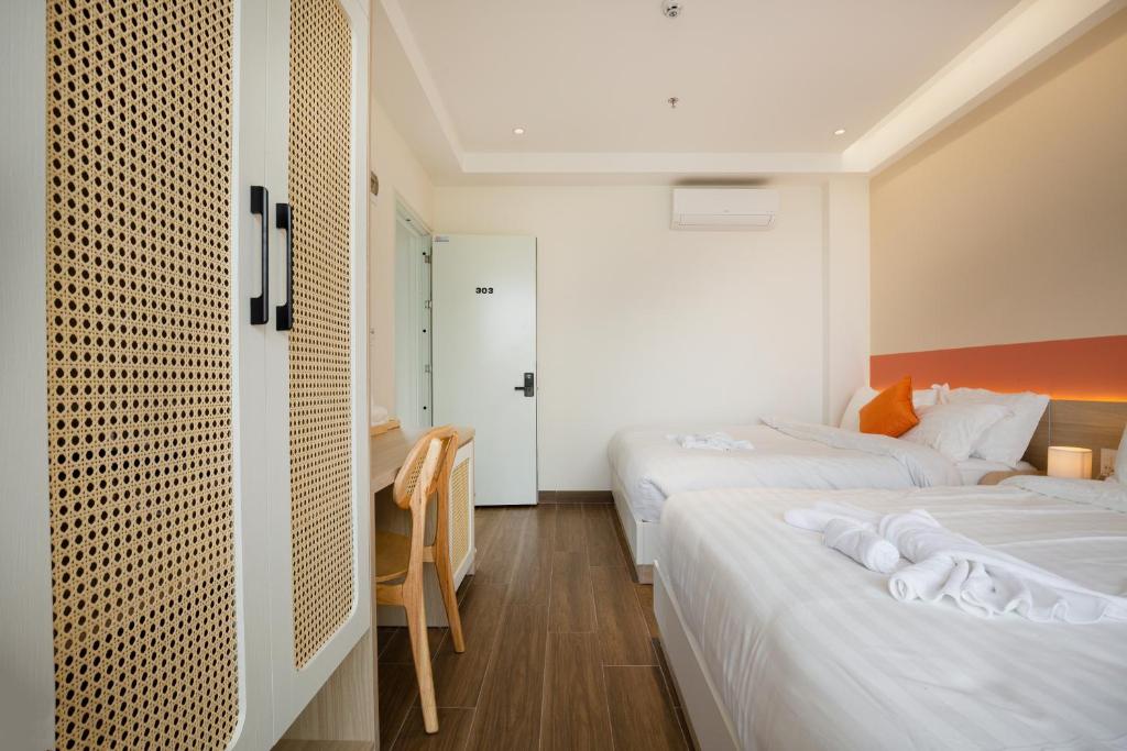 Postel nebo postele na pokoji v ubytování Sonder Homestay Quy Nhon