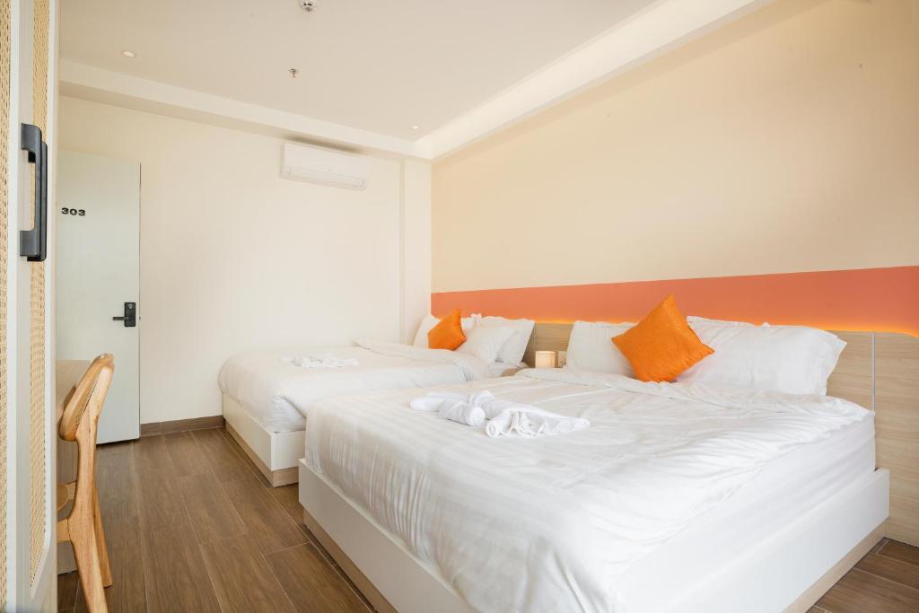 Postel nebo postele na pokoji v ubytování Sonder Homestay Quy Nhon