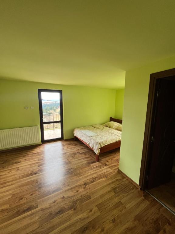 Postel nebo postele na pokoji v ubytování Casa Matis Mărișel