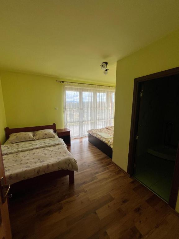 Postel nebo postele na pokoji v ubytování Casa Matis Mărișel