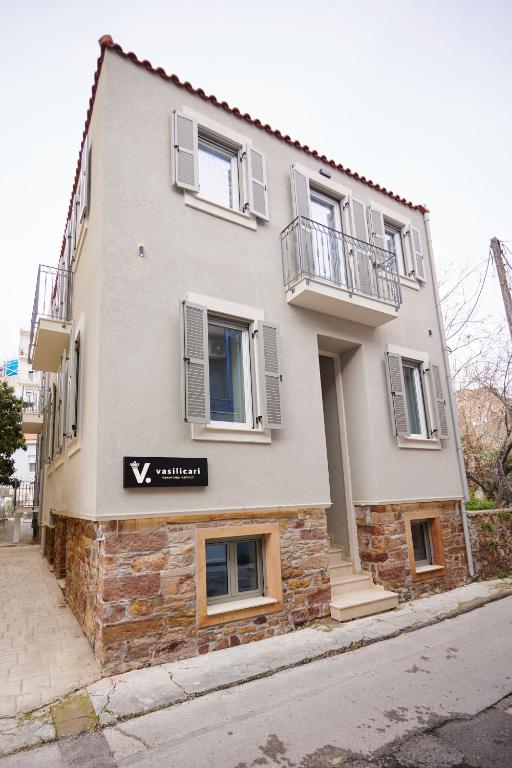 a building on the side of a street at Vasilicari Apartments in Chios
