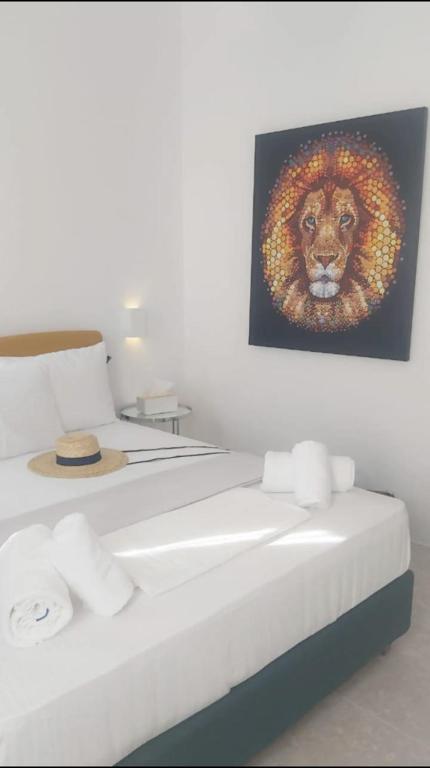 En eller flere senge i et værelse på Kipos Livinn