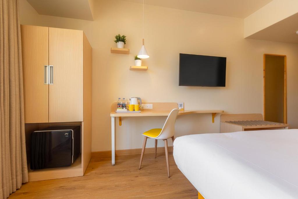 Postel nebo postele na pokoji v ubytování Bloom Hotel - Ranchi