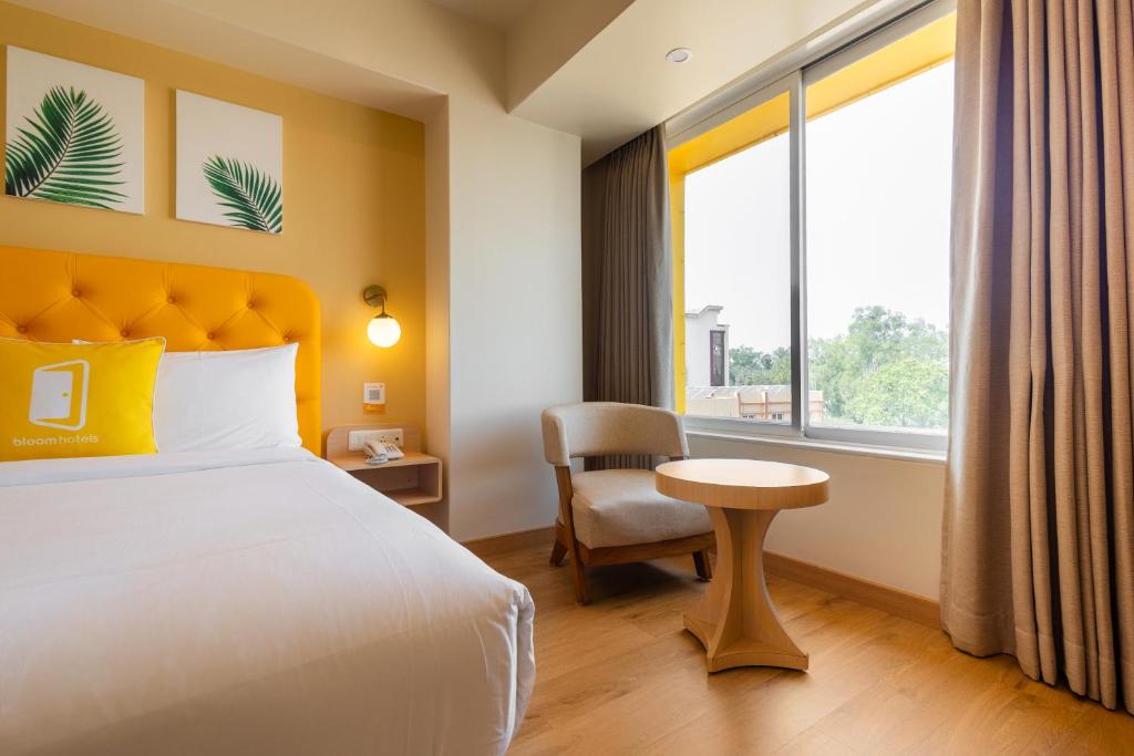 Postel nebo postele na pokoji v ubytování Bloom Hotel - Ranchi