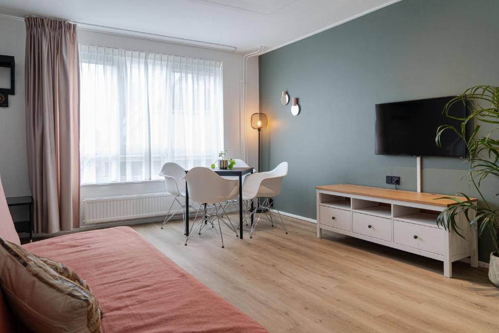 TV a/nebo společenská místnost v ubytování Hotel de Duif Lisse - Keukenhof