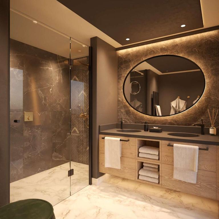 a bathroom with a sink and a mirror at Grand Tirolia Kitzbühel - Member of Hommage Luxury Hotels Collection in Kitzbühel