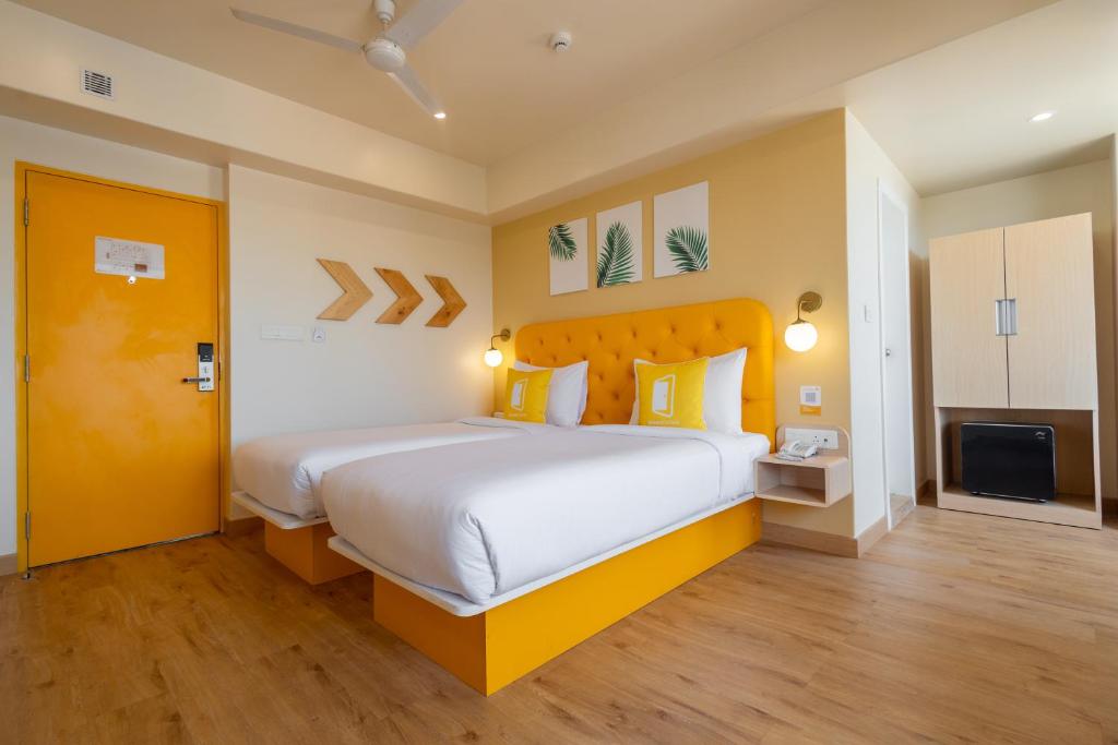 Postel nebo postele na pokoji v ubytování Bloom Hotel - Ranchi
