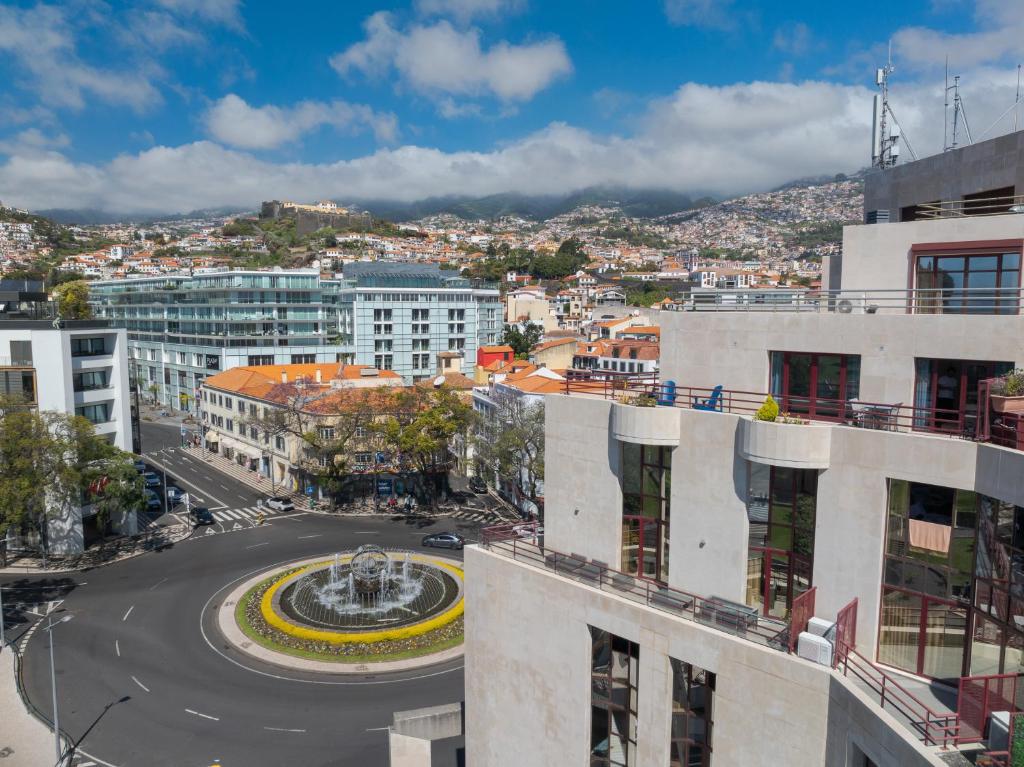 an aerial view of a city with a fountain at Funchal Marina Bay in Funchal