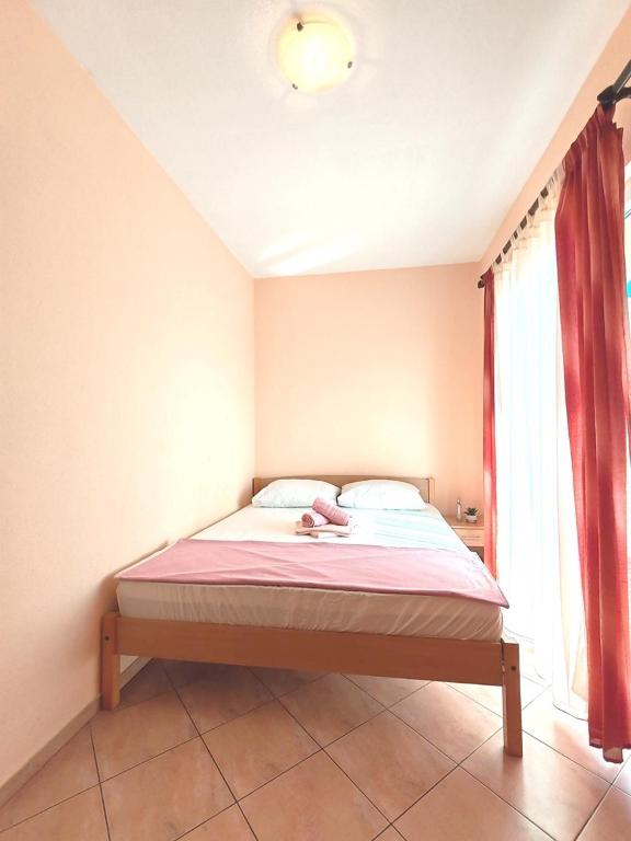 Postel nebo postele na pokoji v ubytování Apartments Draženka