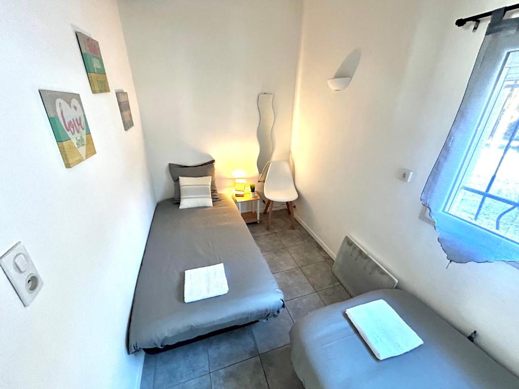Postel nebo postele na pokoji v ubytování Ô'Berge & Chambres Avignon