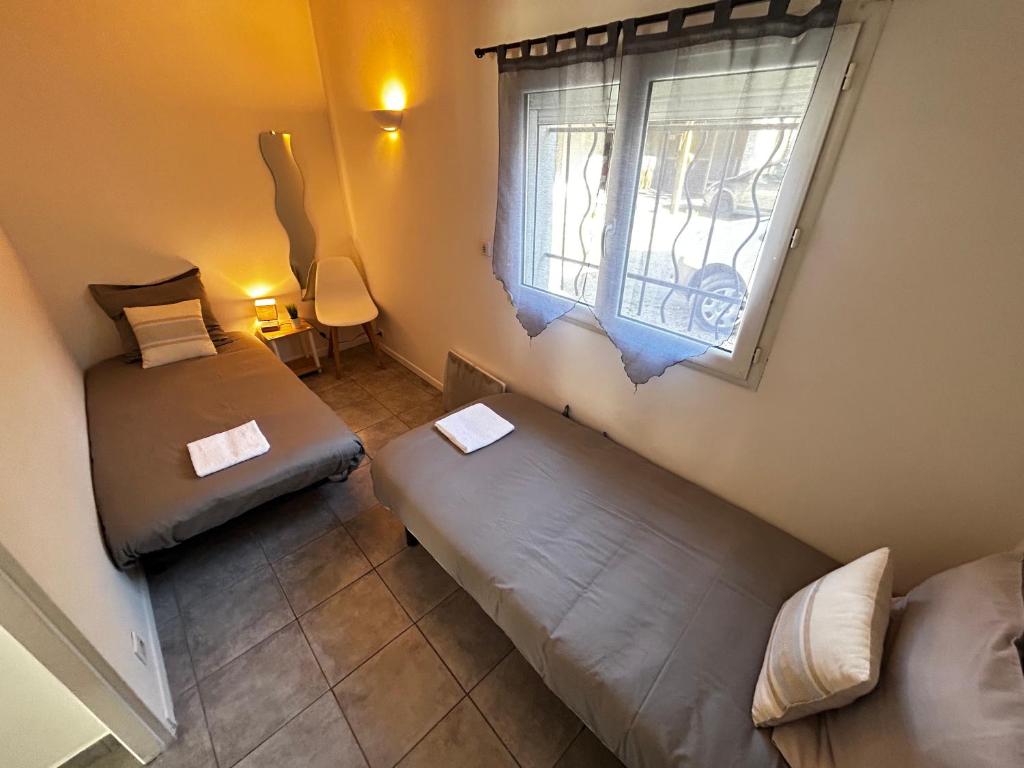 Postel nebo postele na pokoji v ubytování Ô'Berge & Chambres Avignon