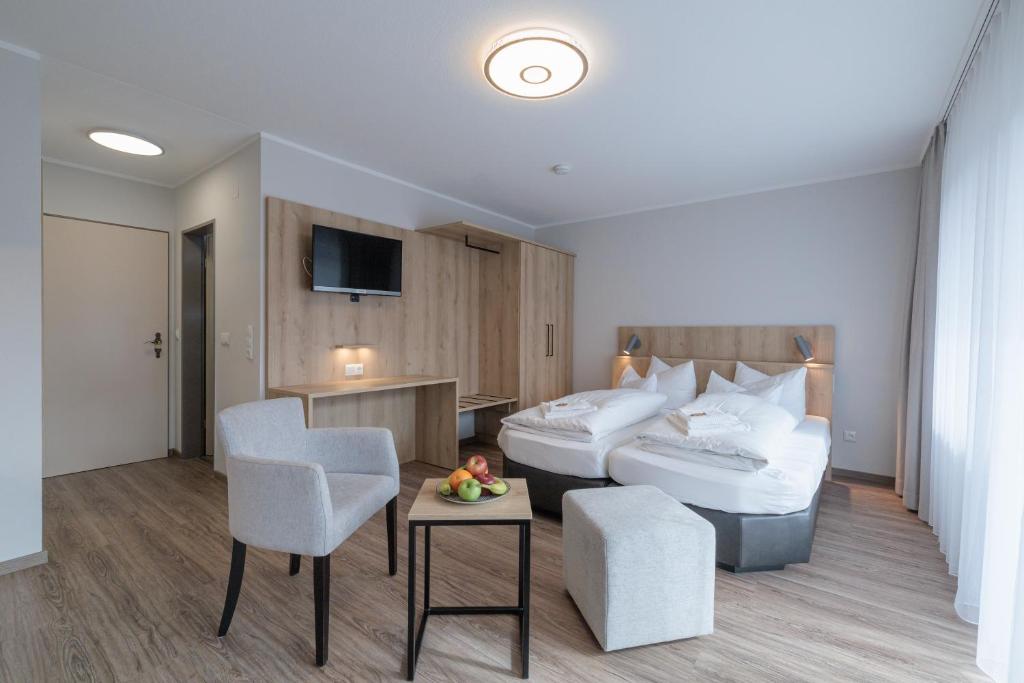Postel nebo postele na pokoji v ubytování Gästehaus Köpf