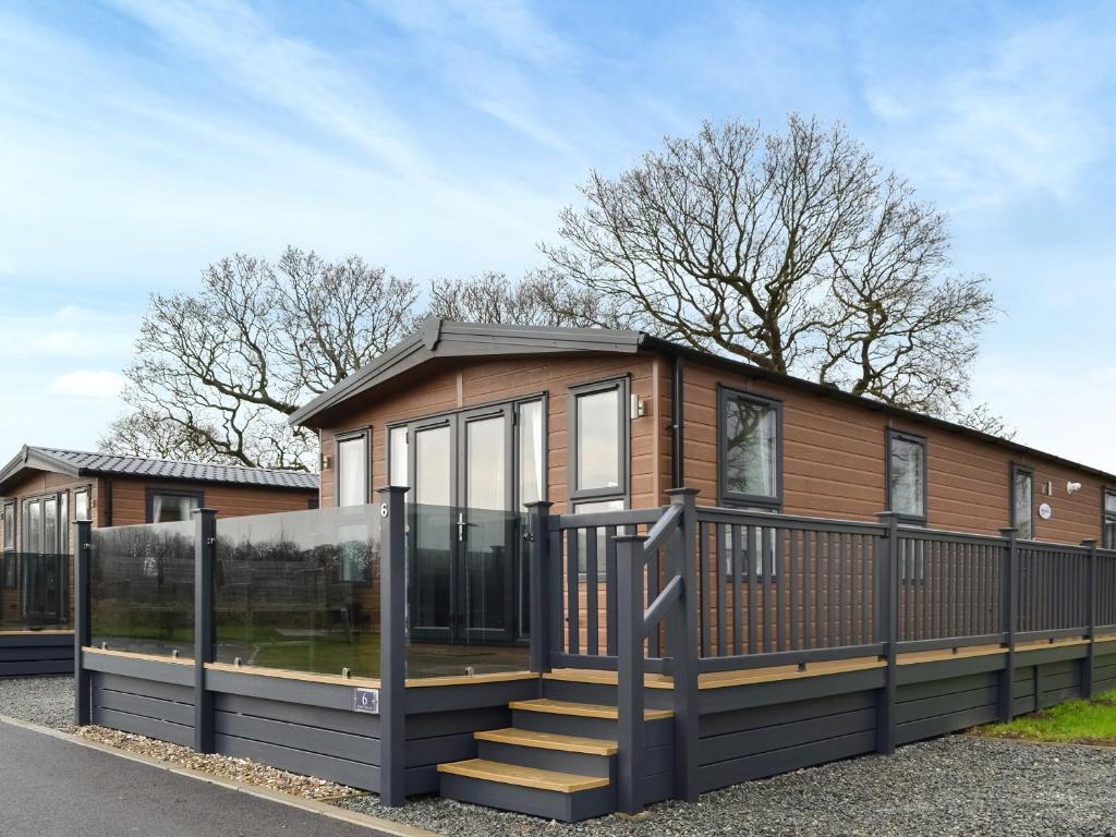a modular home with a glass facade and stairs at Emilys Escape - Uk46722 in Bridlington