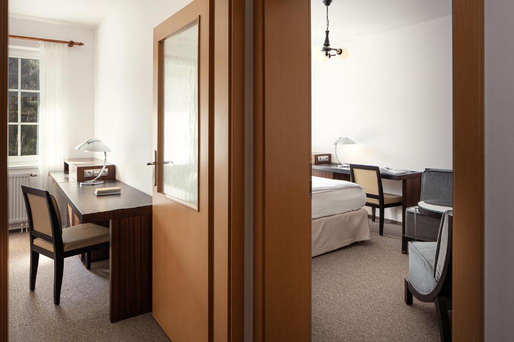 Posteľ alebo postele v izbe v ubytovaní Hotel Adršpach