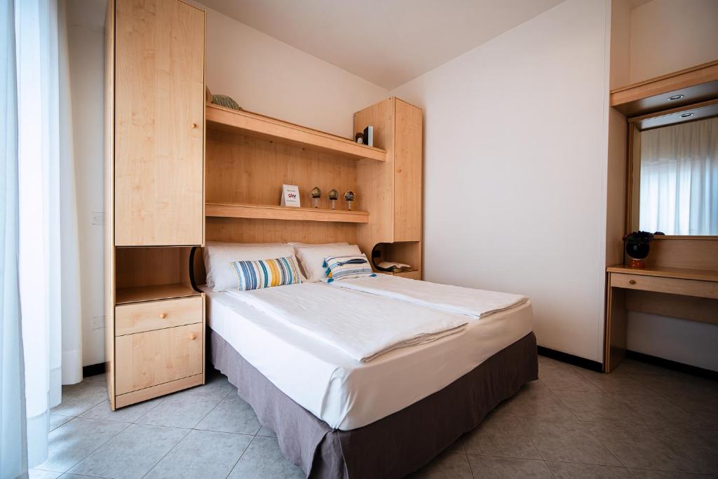 Postel nebo postele na pokoji v ubytování Hotel Niagara