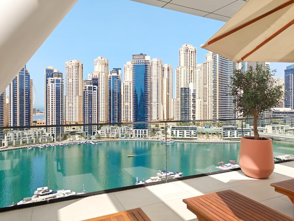 a large window with a view of a large city at Luxury living at Vida Marina & Yacht Club in Dubai