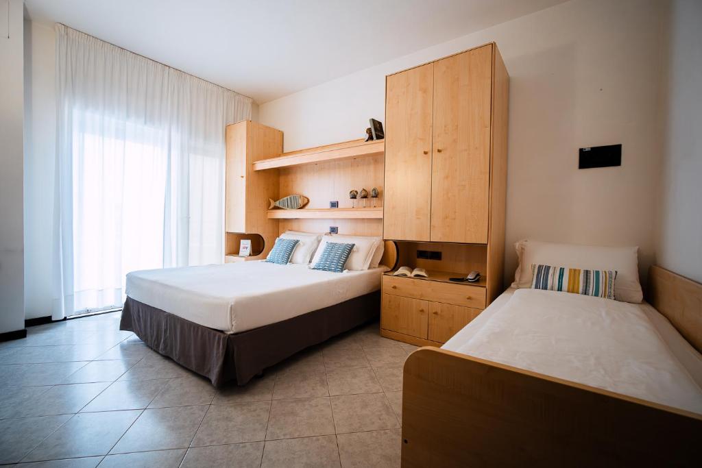 Postel nebo postele na pokoji v ubytování Hotel Niagara