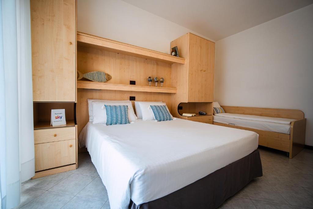 Postel nebo postele na pokoji v ubytování Hotel Niagara