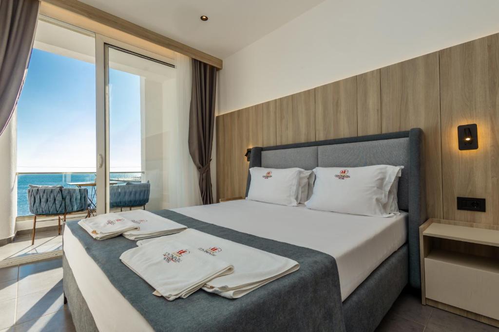 Postel nebo postele na pokoji v ubytování Continental Hotel