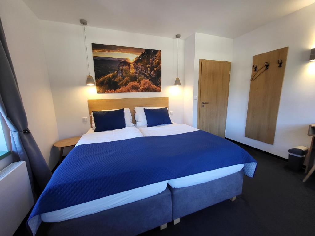 Postel nebo postele na pokoji v ubytování Pension Jitřenka Hřensko Bed & Breakfast