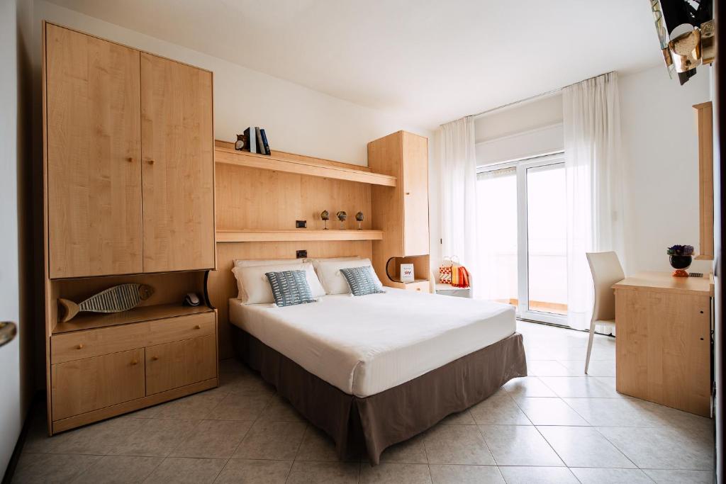 Postel nebo postele na pokoji v ubytování Hotel Niagara