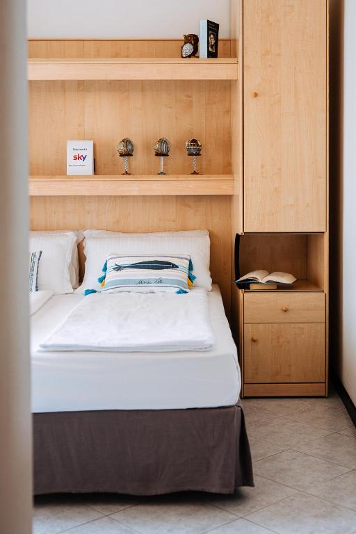 Postel nebo postele na pokoji v ubytování Hotel Niagara