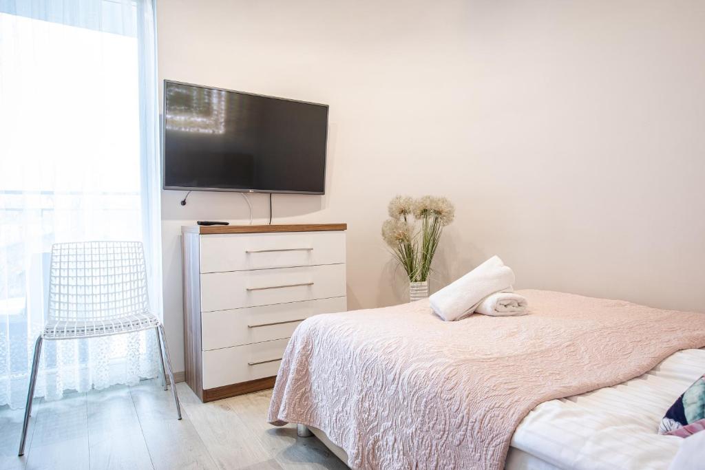 Posteľ alebo postele v izbe v ubytovaní Apartamenty & Spa Stara Polana