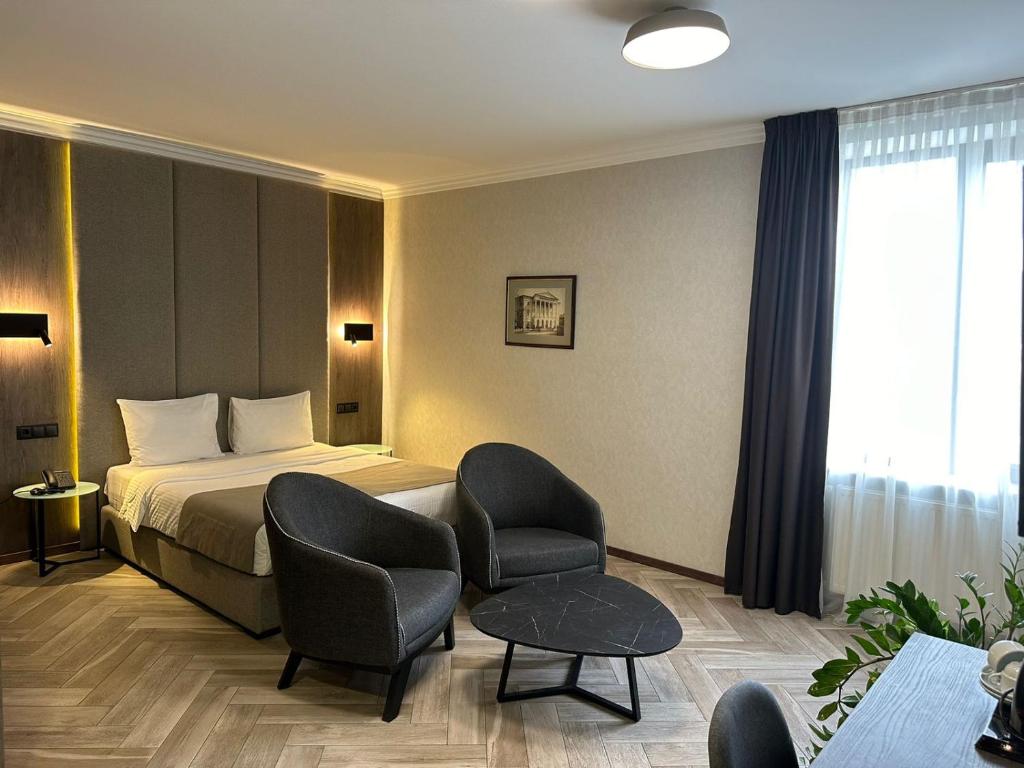 Postel nebo postele na pokoji v ubytování Hotel Old Wall