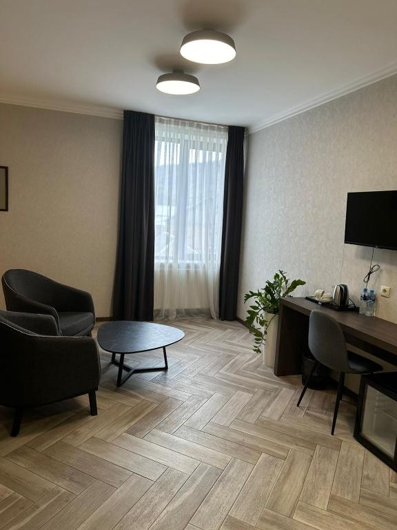 TV a/nebo společenská místnost v ubytování Hotel Old Wall