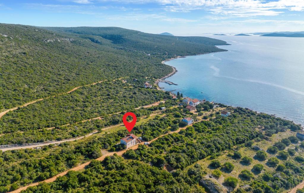 an aerial view of an island with a red marker at 4 Bedroom Amazing Home In Banj in Banj