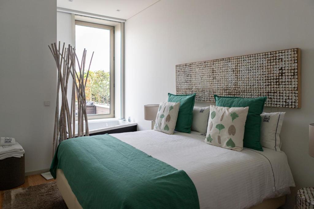 Ένα ή περισσότερα κρεβάτια σε δωμάτιο στο Porto Deluxe Palace