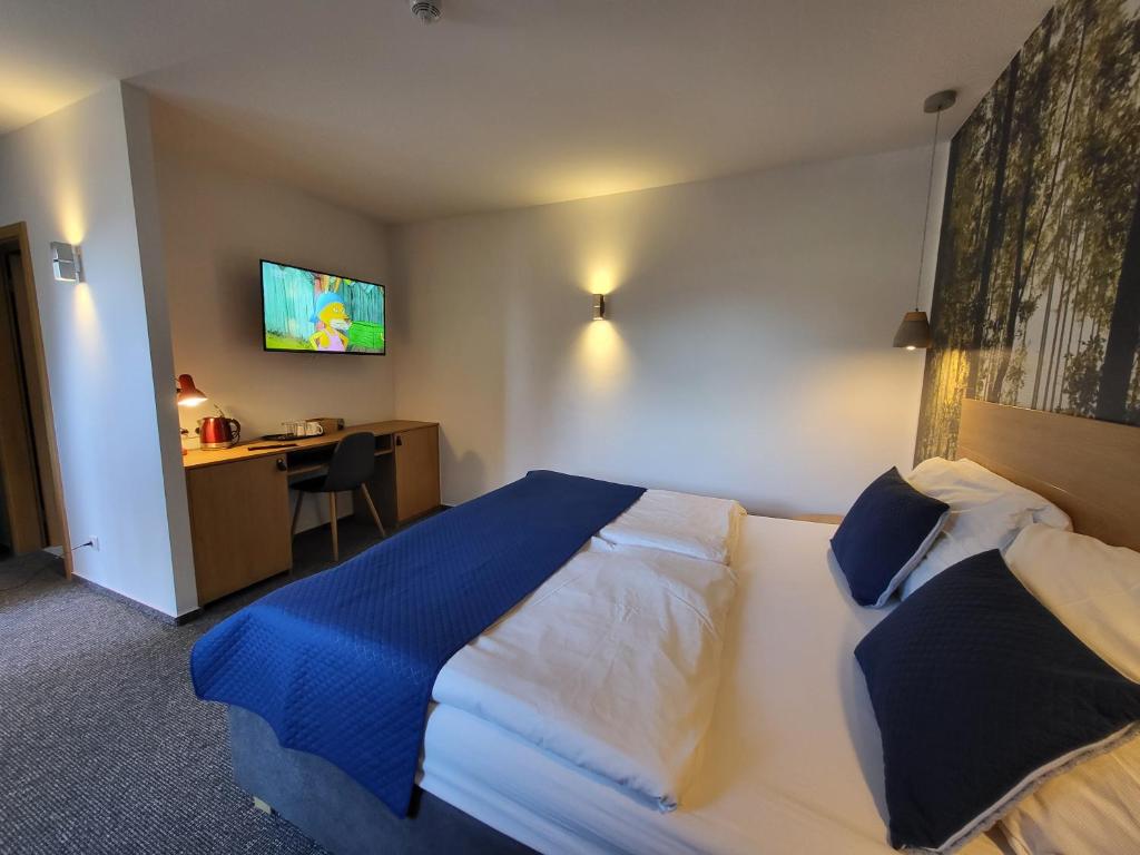 Postel nebo postele na pokoji v ubytování Pension Jitřenka Hřensko Bed & Breakfast