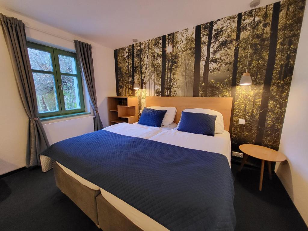 Postel nebo postele na pokoji v ubytování Pension Jitřenka Hřensko Bed & Breakfast