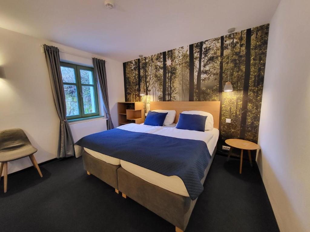Postel nebo postele na pokoji v ubytování Pension Jitřenka Hřensko Bed & Breakfast