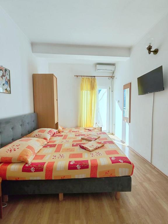 Postel nebo postele na pokoji v ubytování Apartmani i sobe Šagarjelo