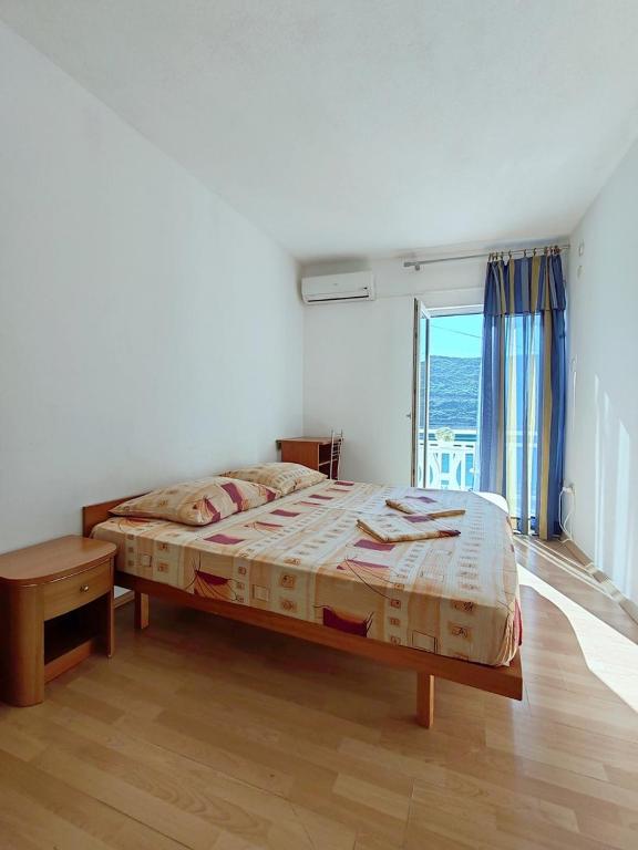 Postel nebo postele na pokoji v ubytování Apartmani i sobe Šagarjelo