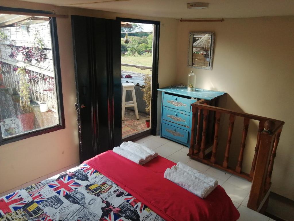 A bed or beds in a room at Terracota Mirador Filandia