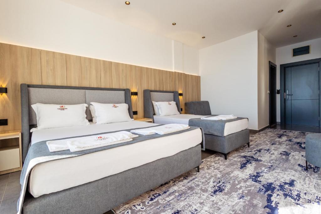 Postel nebo postele na pokoji v ubytování Continental Hotel