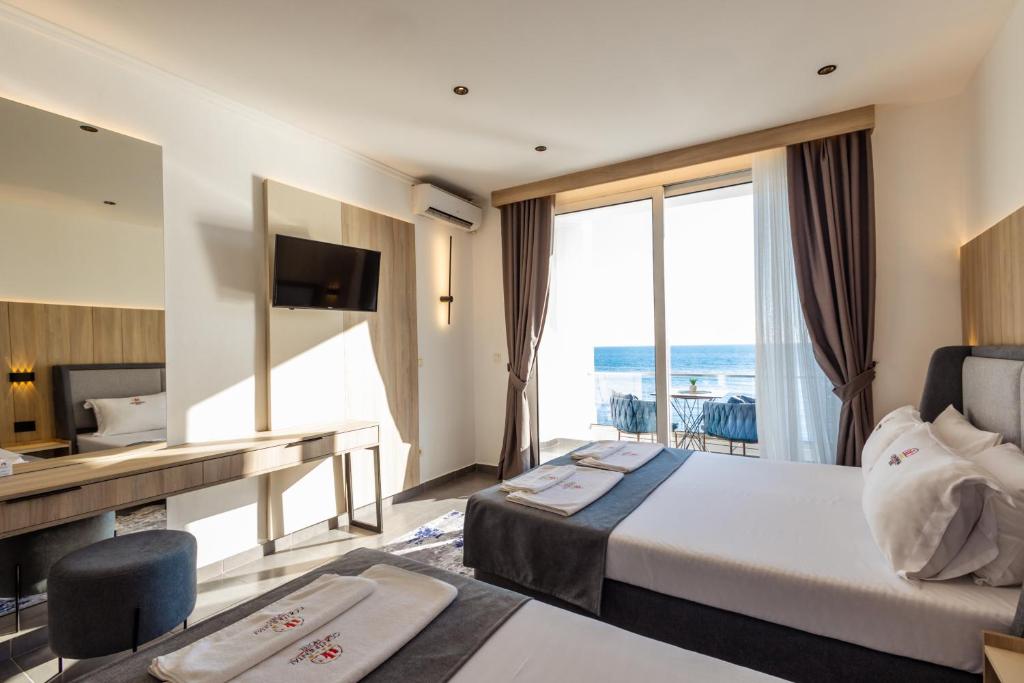 Postel nebo postele na pokoji v ubytování Continental Hotel