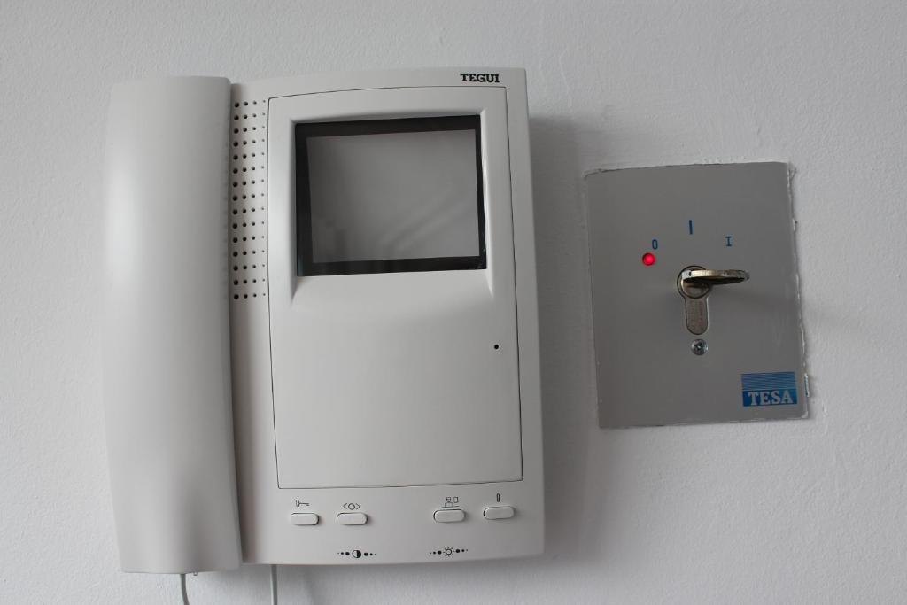 a nintendo wii controller is attached to a wall at Apartamentos turísticos Vistademar in Luarca