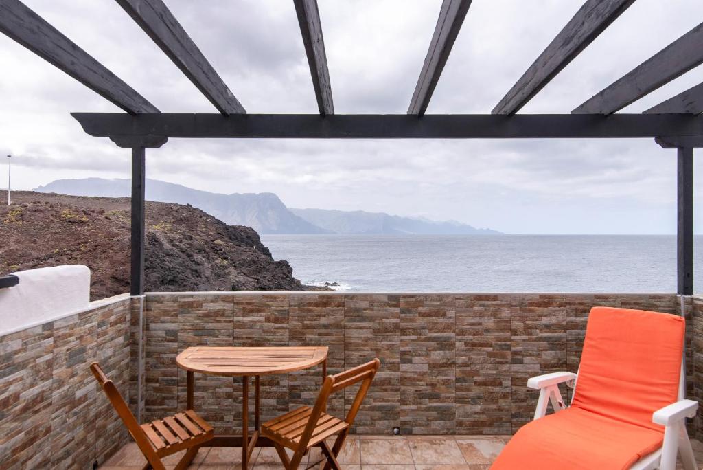 Un balcon sau o terasă la Faro de Sardina Frente al Mar