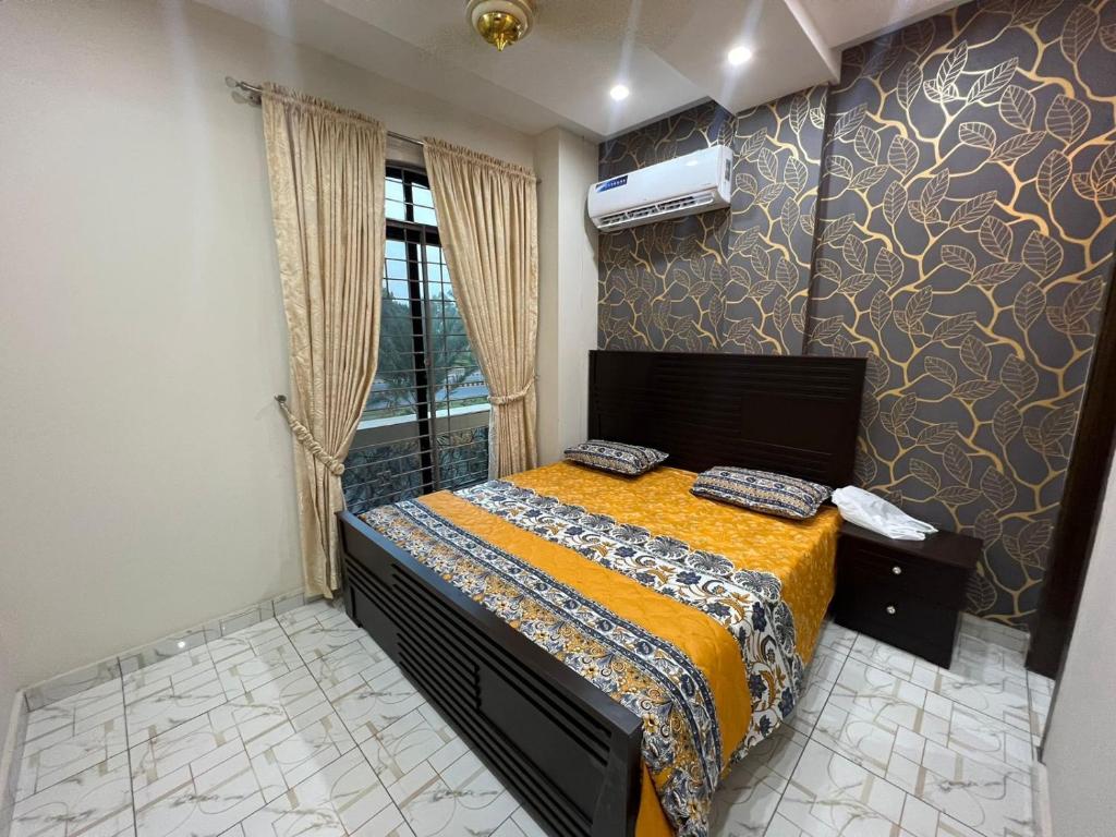 Postel nebo postele na pokoji v ubytování Uptown Residences