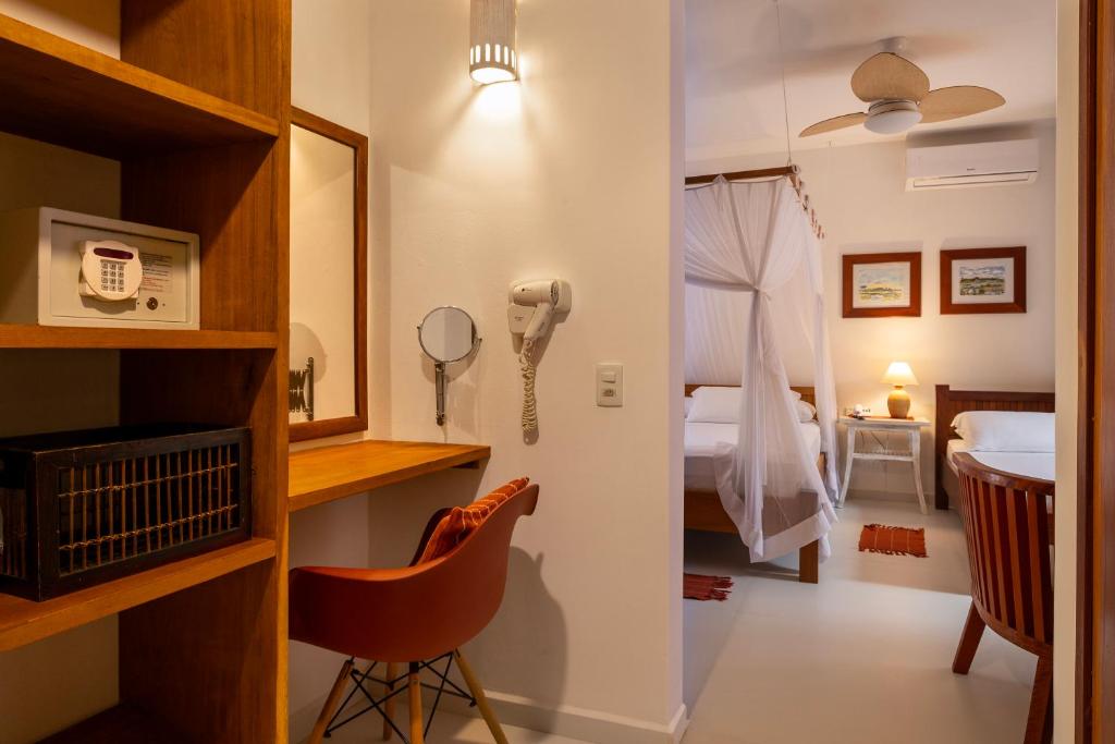 Postel nebo postele na pokoji v ubytování Pousada Quarto Crescente