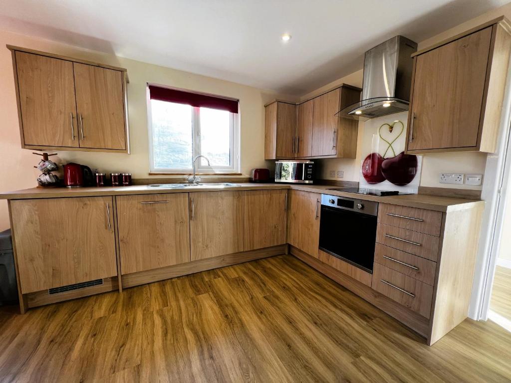 Kuchyň nebo kuchyňský kout v ubytování Cherry Lodge