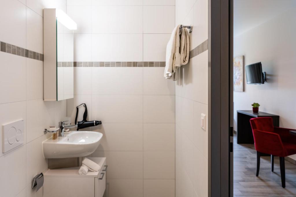 Koupelna v ubytování Motel-Résidence Ô Pied à Terre