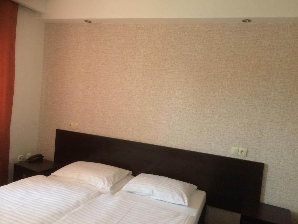 Ένα ή περισσότερα κρεβάτια σε δωμάτιο στο Promohotel Slavie