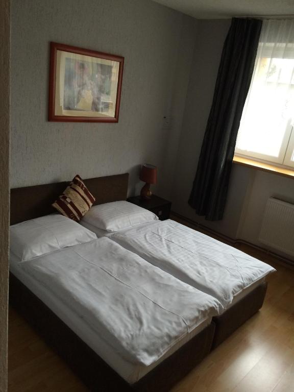 Ένα ή περισσότερα κρεβάτια σε δωμάτιο στο Promohotel Slavie