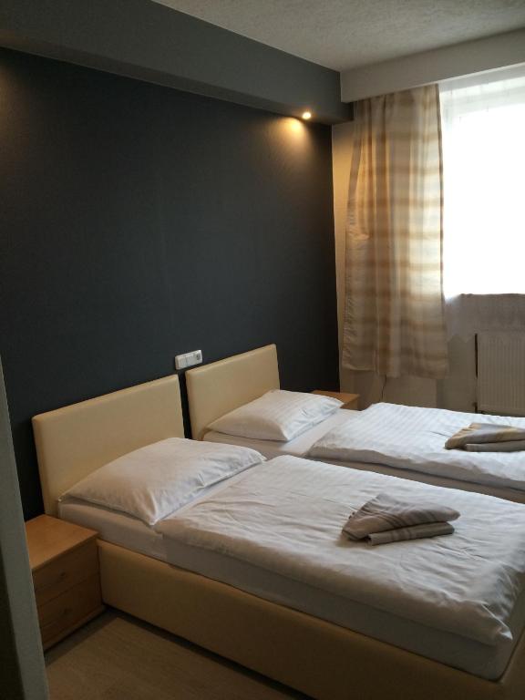 Ένα ή περισσότερα κρεβάτια σε δωμάτιο στο Promohotel Slavie